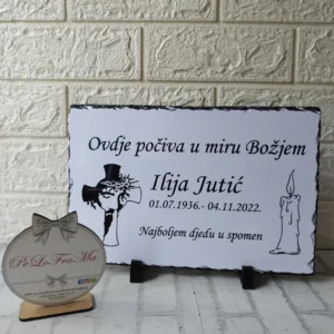 Spomen ploča s križem i svijećom